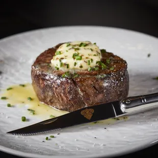 a steak with butter and chives