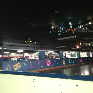 Rink and the "other side" of it. Beyond the rink wall, on that side, is a small arcade, the very small "baby rink", &amp; bday area