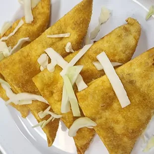 a plate of quesadillas on a table