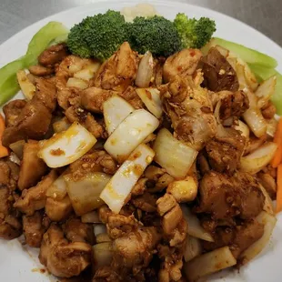 a plate of chicken and vegetables