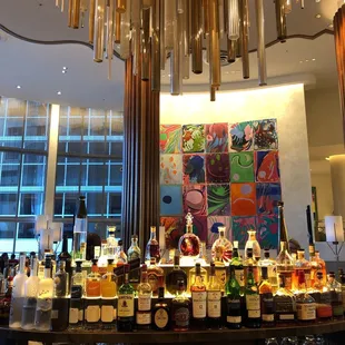 a large chandelier filled with liquor bottles