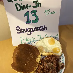 Corn beef hash, pancakes, and eggs