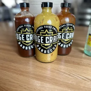 three bottles of barbecue sauce