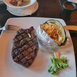 Ribeye with loaded baked potato