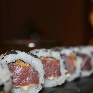 The Big Eye Tuna Roll was made with crisp onion, sushi rice, and yuzu kosho.