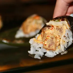 The Big Eye Tuna Hand Roll is made with crisp onion, sushi rice and yuzu kosho.