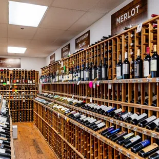 a wine rack with many bottles of wine