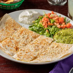 a quesadilla and a salad