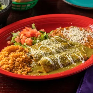 a plate of enchiladas and rice