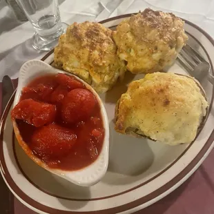 Double crabcakes with stewed tomatoes and twice baked potato
