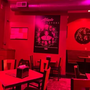 a dining room with red lighting