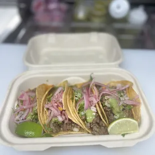 Tacos de Asada. Topping Avocado Sauce/ pickles onions