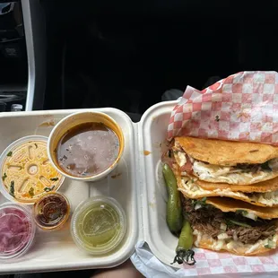 quesabirria tacos! Delicious. Love that they give different salsas with peppers and onions.