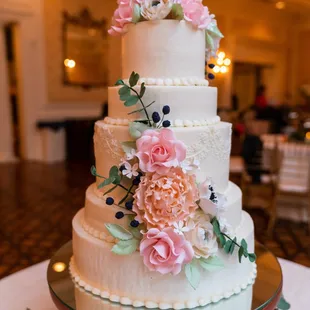 a wedding cake decorated with flowers