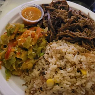 Brisket, jollof rice and veggies.