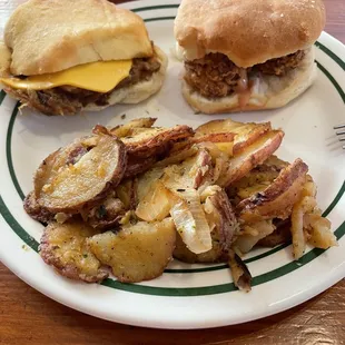 a hamburger and potatoes on a plate