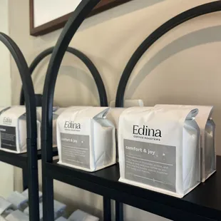 a shelf of coffee roasters