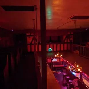 a long table with lit candles