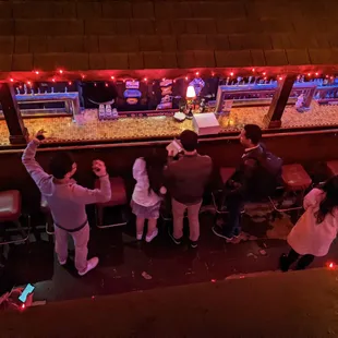 a group of people at a bar