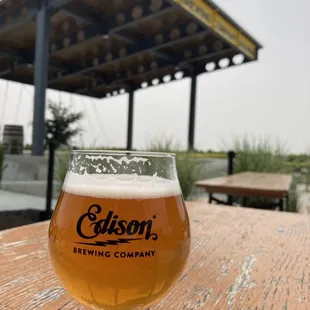 a glass of beer on a table