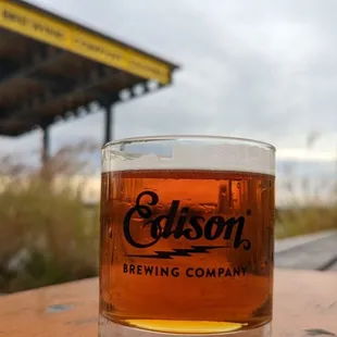 a glass of beer on a table