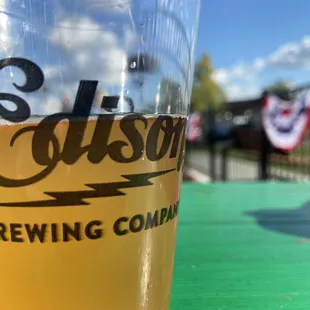 a glass of beer on a table