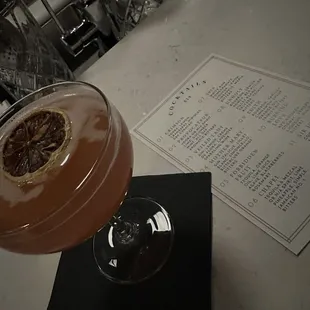 a grapefruit cocktail in a coupe glass