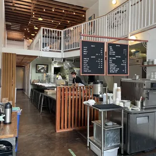 a kitchen with a staircase