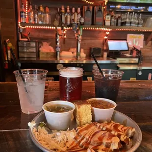 ows a plate of food and drinks