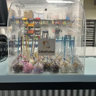 a counter with a variety of desserts