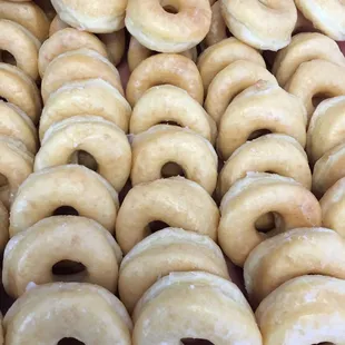a pile of glazed donuts