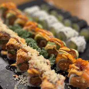 a plate of sushi rolls on a table