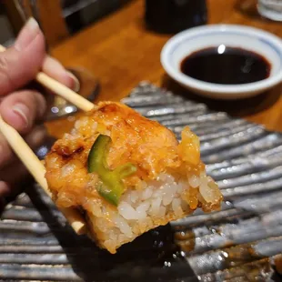 Inside of Crispy Rice topped with spicy salmon. Must try.