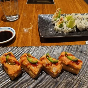Inside of Crispy Rice topped with spicy salmon. Must try.  Shrimp tempura roll in the back.