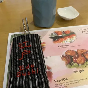 a menu and a cup of coffee