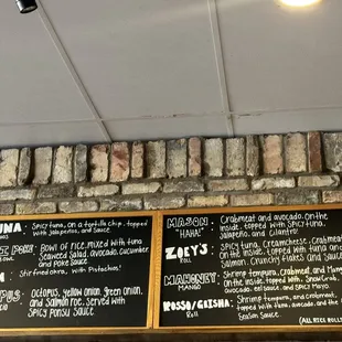 menus on a brick wall