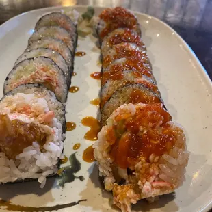 two pieces of sushi on a plate