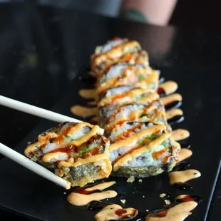 Godzilla Roll
-Salmon, Avocado and Cream Cheese, deep fried and topped with Spicy Mayo and Eel Sauce
