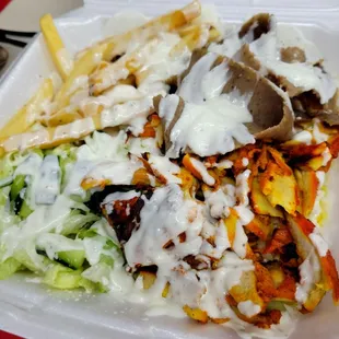 a plate of food in a styrofoam container