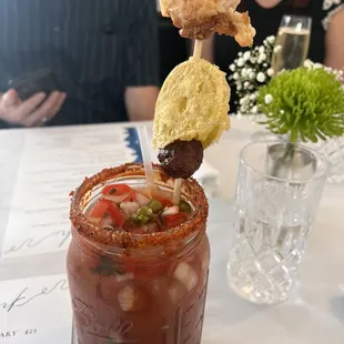 Mexi-Cali Bloody Mary. With pickled fried green tomato, tequila, and chorizo sausage