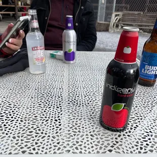 two bottles of soda on a table