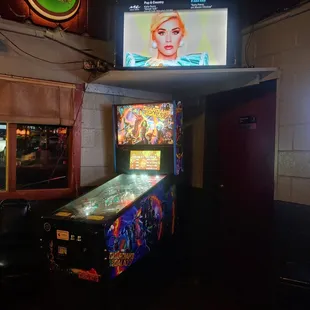 a pinball machine in the foreground