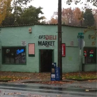 a green building on a rainy day