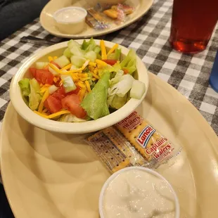 a plate of salad with dressing