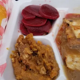 Roasted turkey with yam casserole, beets, and yeast rolls