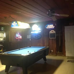 a pool table in a game room