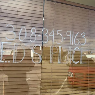 the reflection of a man in the window