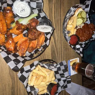a variety of wings and fries