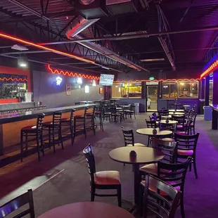 tables and chairs with neon lights