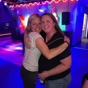 two women hugging each other